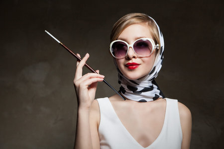 young stylish caucasian woman posing, over dark , retro styling