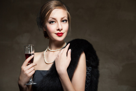 Portrait of beautiful woman with glass red wine  Retro styleの写真素材