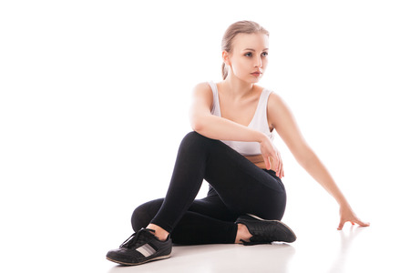 picture of beautiful sporty woman doing exercise isolated over white backgroundの写真素材