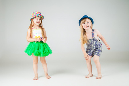 Cute little girls on white background. Fashion shotの写真素材