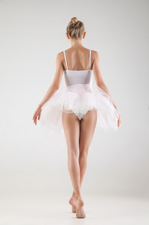 Ballerina in classical tutu over the white studio backgroundの写真素材