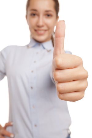 Happy smiling business woman with ok hand sign isolated over white backgroundの写真素材