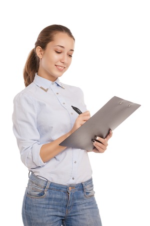 Portrait of smiling business woman with paper folder, isolated on white backgroundの写真素材
