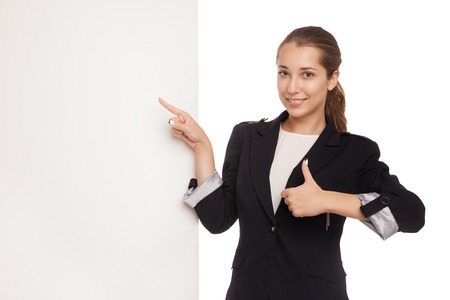 Portrait of a beautiful business woman holding blank billboard Isolated over white backgroundの写真素材