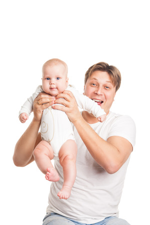 Happy young man holding a smiling baby isolated on whiteの写真素材
