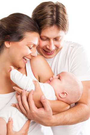 Portrait of a young happy family with the kid over white backgroundの写真素材