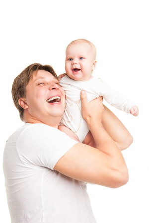 Happy young man holding a smiling baby isolated on whiteの写真素材