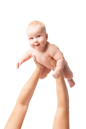 Hands  lift up  little baby high, on white background, isolatedの写真素材