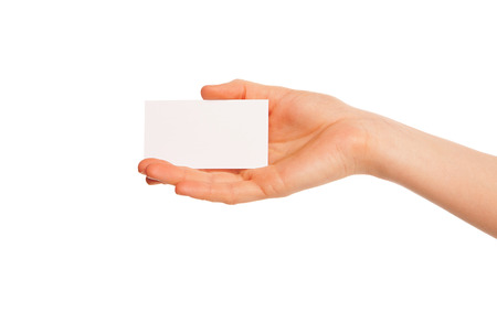 one hand holding a white piece of cardboard. Hand to left.の写真素材