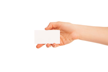 one hand holding a white piece of cardboard. Hand to left, fingers down.の写真素材