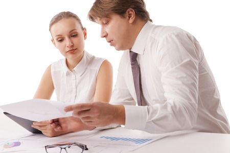 Photo of confident employees discussing papers at meeting. Isolated over white background.の写真素材