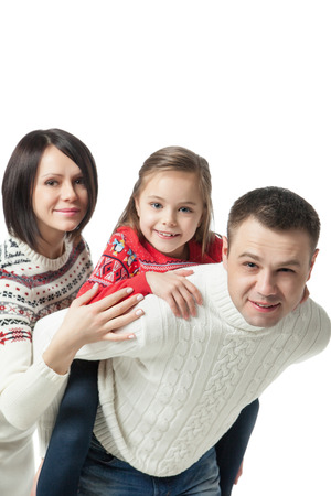 portrait of happy young family standing together isolated on whiteの写真素材