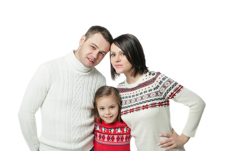 portrait of happy young family standing together isolated on whiteの写真素材