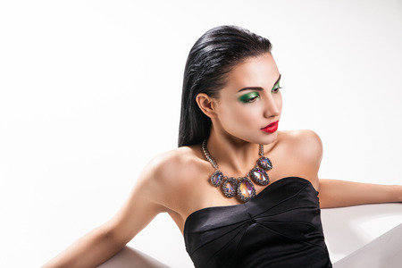 Fashion photo of young magnificent woman posing at studioの写真素材