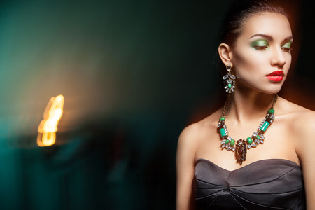 Fashion photo of young magnificent woman posing at studioの写真素材