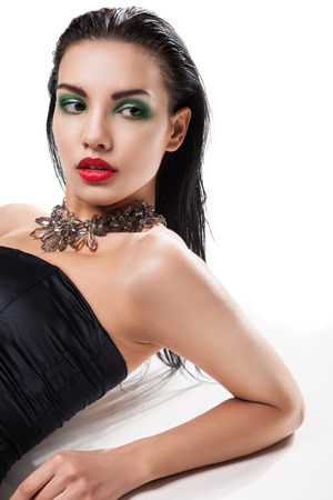 Fashion photo of young magnificent woman posing at studioの写真素材