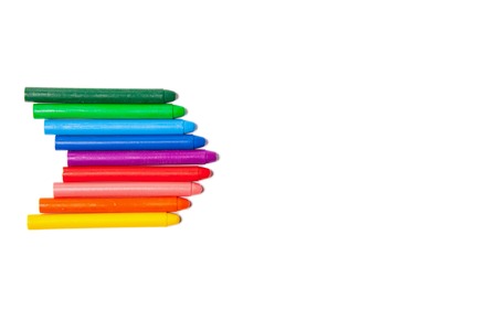 Crayons lined up in rainbow isolated on white background.の写真素材