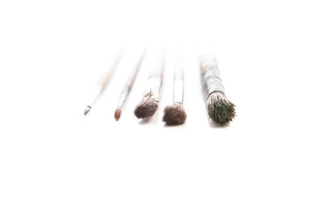Dirty used paintbrushes isolated on white backgroundの写真素材