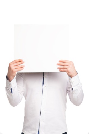 close up of man hands showing white blank board isolated on whiteの写真素材