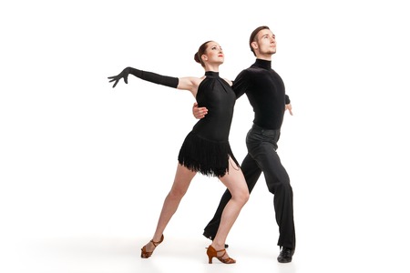 Beautiful two professional artists dancing over white backgroundの写真素材