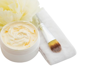 Cosmetic cream, headband and yellow flower, spa, skincare or haircare or bodycare, isolated on whiteの写真素材