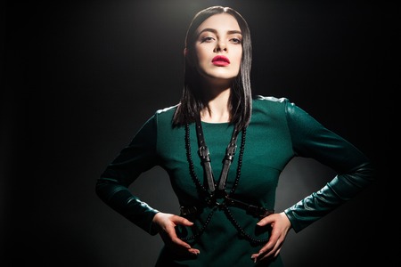 Portrait of fashionable woman with bright lips against of black backgroundの写真素材
