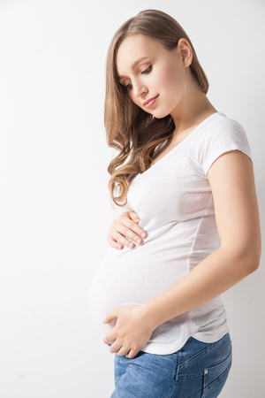 Portrait of attractive young woman waiting for babyの写真素材