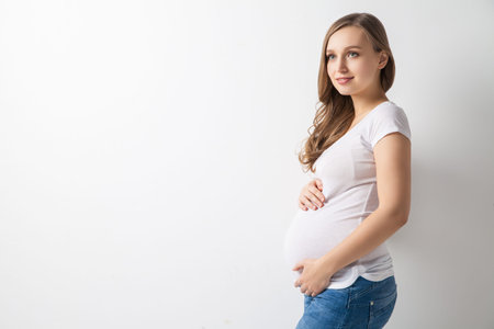 Portrait of smiling woman expecting baby.Studio shot