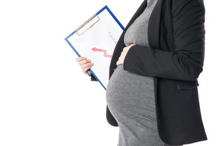 Unrecognizable pregnant businesswoman in close-up. Studio shotの写真素材