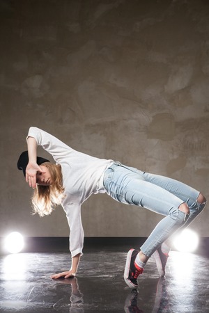 Portrait of young woman performing street dance.Studio shotの写真素材