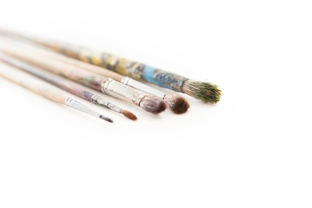 Dirty used paintbrushes isolated on white backgroundの写真素材