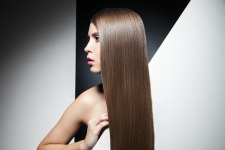 Beautiful hair of young brunette in close-upの写真素材