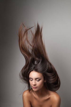 Woman thrown up her hairの写真素材