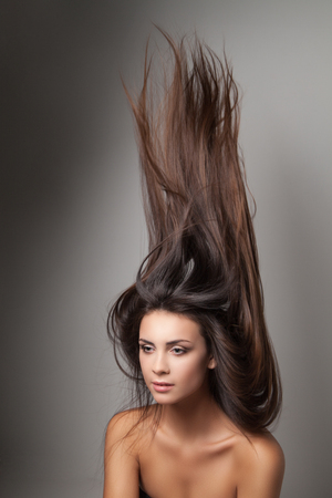 Woman thrown up her hairの写真素材