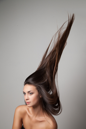 Woman thrown up her hairの写真素材