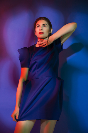 Pretty young woman wearig blue dressの写真素材