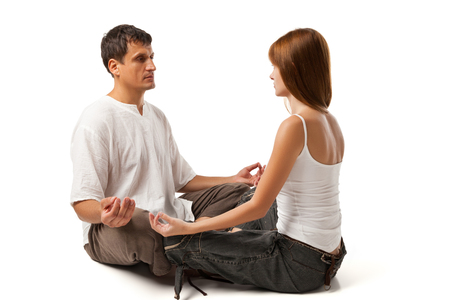 Healthy couple in yoga position on whiteの写真素材