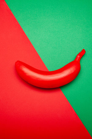 Red ripe banana placed on two color background