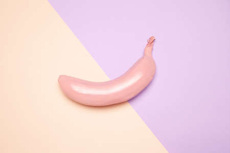 Pink colored ripe banana on minimalist surfaceの写真素材