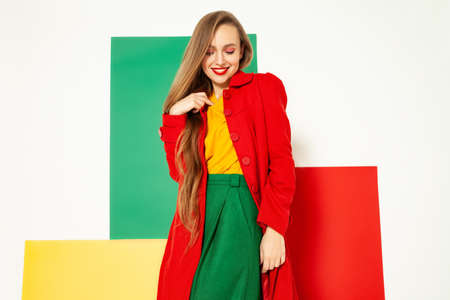 Smiling fashionable woman in bright colorful outfitの写真素材