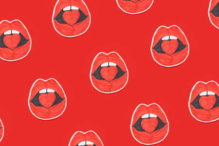 Background of similar stickers with red lips and heart in mouthの写真素材