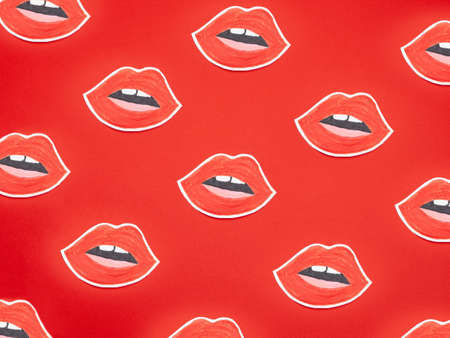 Set of lips shaped stickers on red backgroundの写真素材