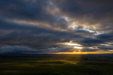 Sunrays dance across above Gordale Scar, Malham, in the Yorkshire Dales National Parkの写真素材