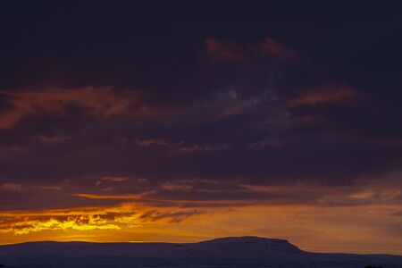 A Sunrise over Penyghent, Pen-y-ghent or Penyghent in the Yorkshire Dales, Englandの写真素材