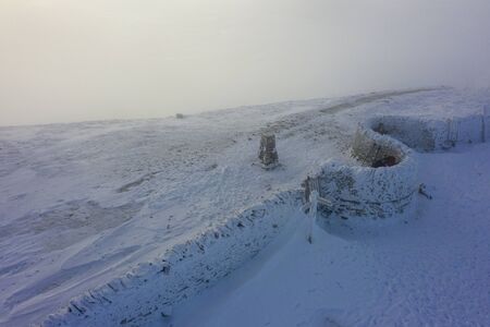 summit of penyghent covered in snowの写真素材