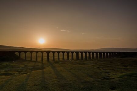 Sunset over Iconic Yorkshire Landmark Ribblehead Viaductの写真素材