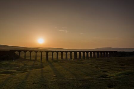 Sunset over Iconic Yorkshire Landmark Ribblehead Viaductの写真素材