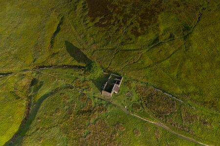 An aerial Sunrise drone shot of Top Withens or Top Withins, this farmhouse has been associated withの写真素材