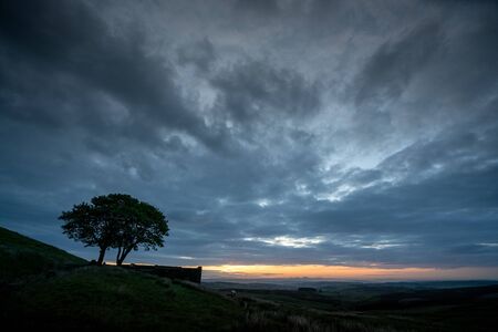 An aerial Sunrise drone shot of Top Withens or Top Withins, this farmhouse has been associated withの写真素材
