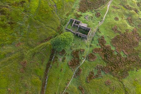 An aerial Sunrise drone shot of Top Withens or Top Withins, this farmhouse has been associated withの写真素材